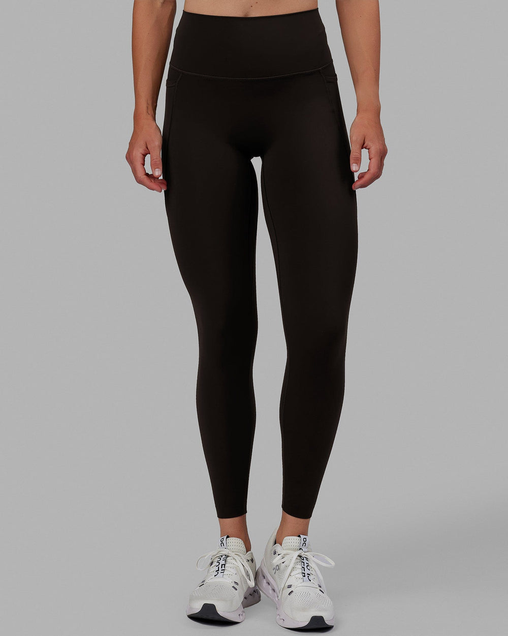 Woman wearing Elixir Full Length Tights With Pockets - Dark Walnut