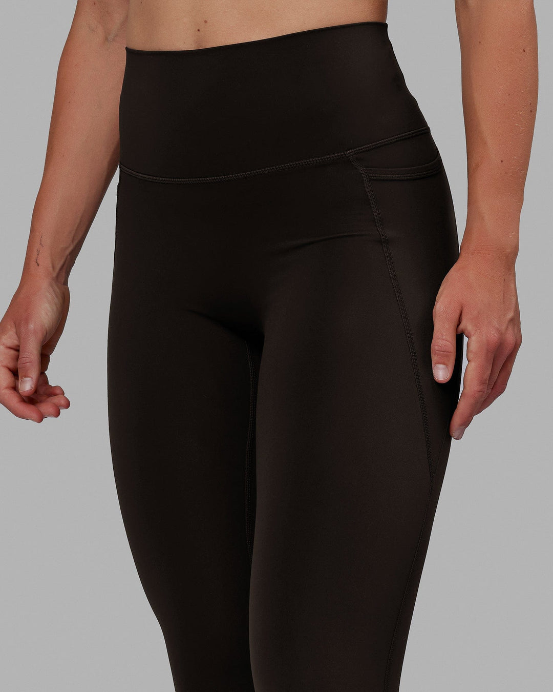 Woman wearing Elixir Full Length Tights With Pockets - Dark Walnut