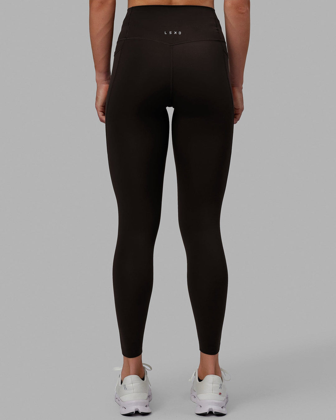 Woman wearing Elixir Full Length Tights With Pockets - Dark Walnut