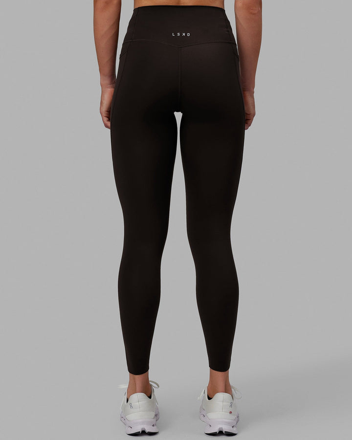 Woman wearing Elixir Full Length Tights With Pockets - Dark Walnut