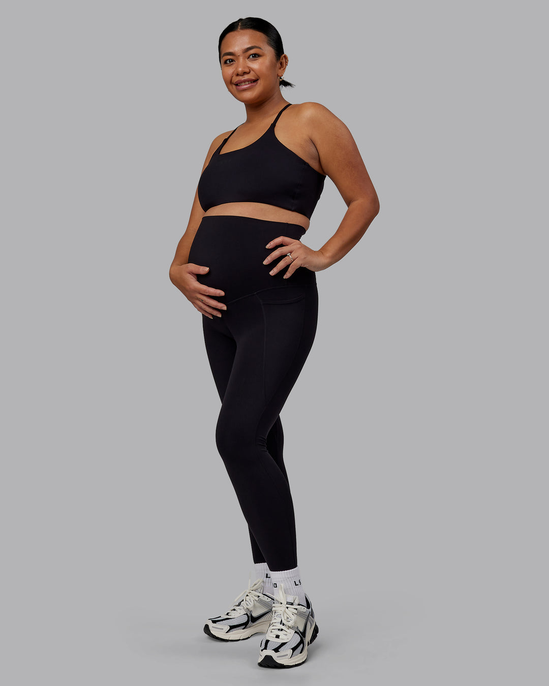 Woman wearing Elixir Ultra High-Rise Maternity Full Length Legging Pockets - Black | Model:Jojo | Size:M
