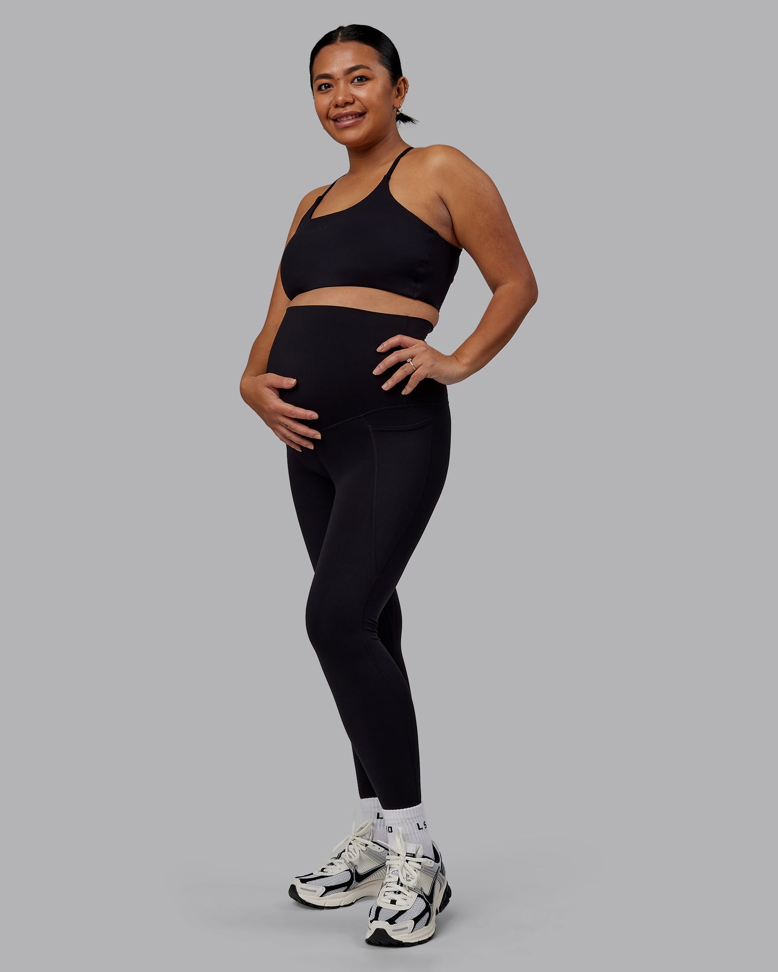 Woman wearing Elixir Ultra High-Rise Maternity Full Length Legging Pockets - Black | Model:Jojo | Size:M
