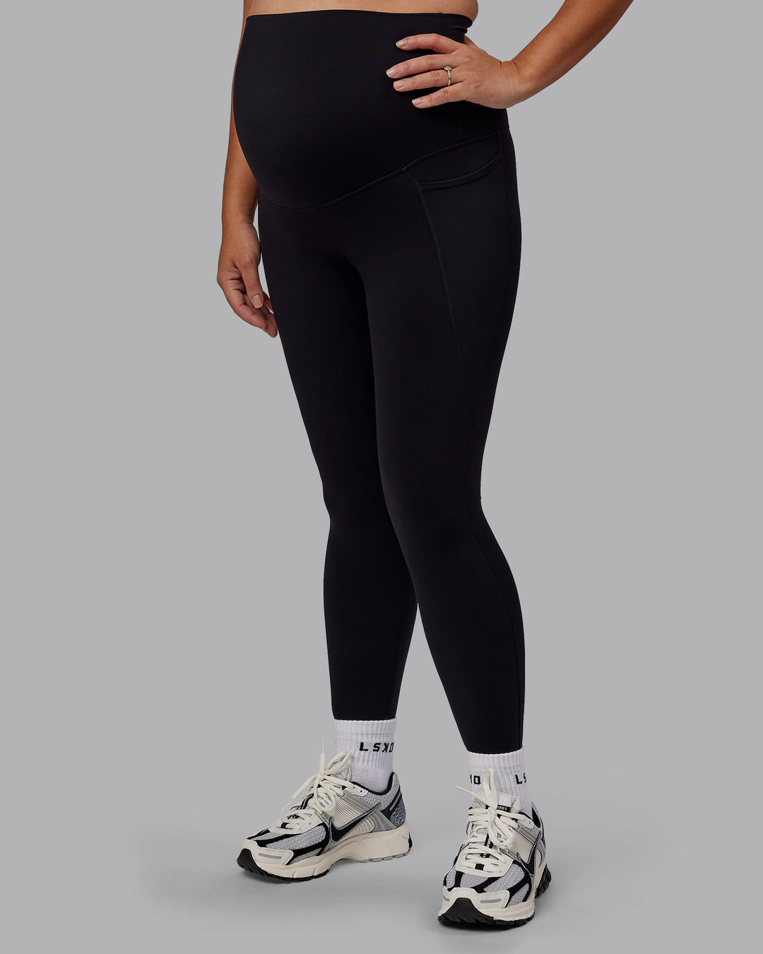 Woman wearing Elixir Ultra High-Rise Maternity Full Length Legging Pockets - Black | Model:Jojo | Size:M