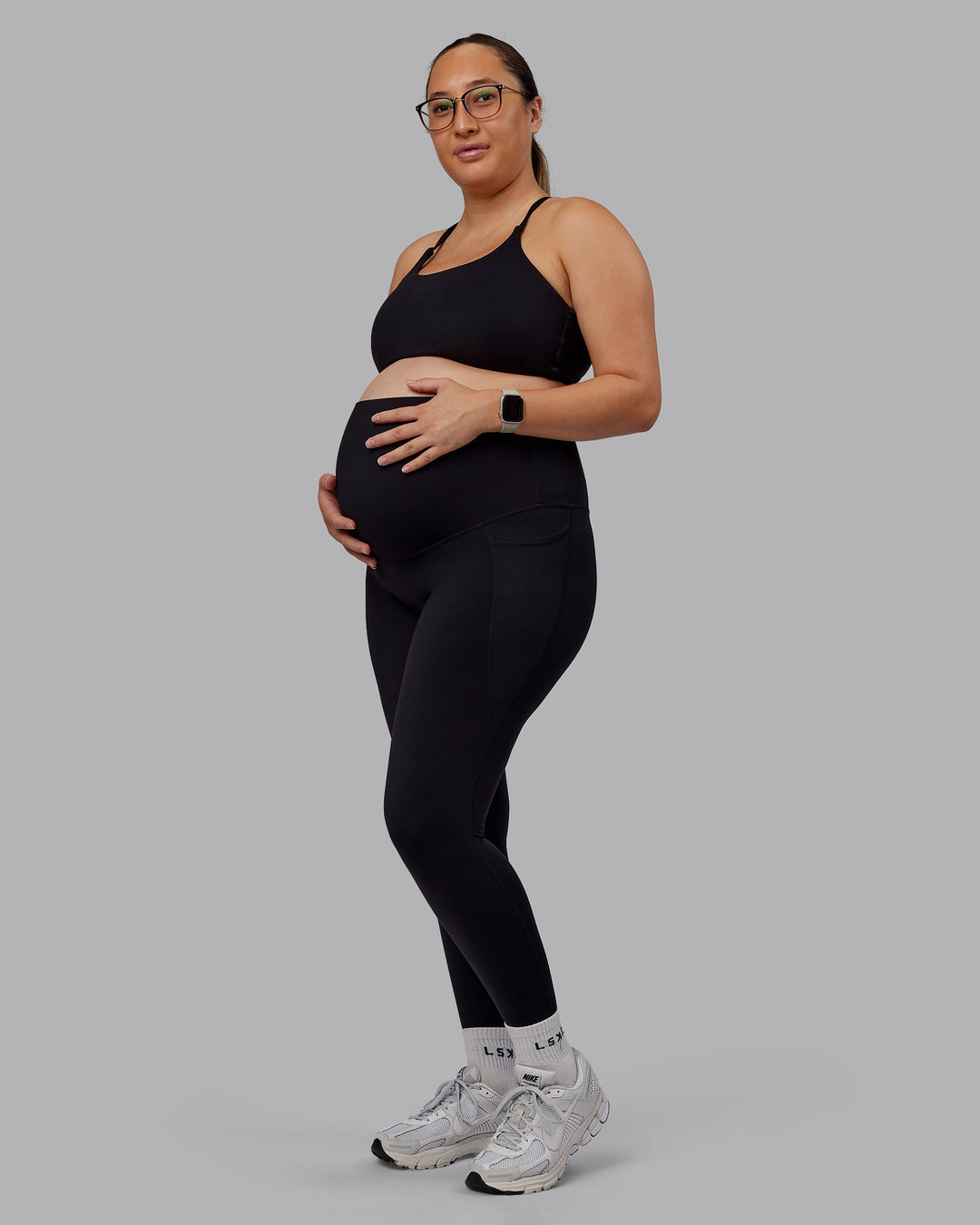 Woman wearing Elixir Ultra High-Rise Maternity Full Length Legging Pockets - Black | Model:Nevada | Size:M