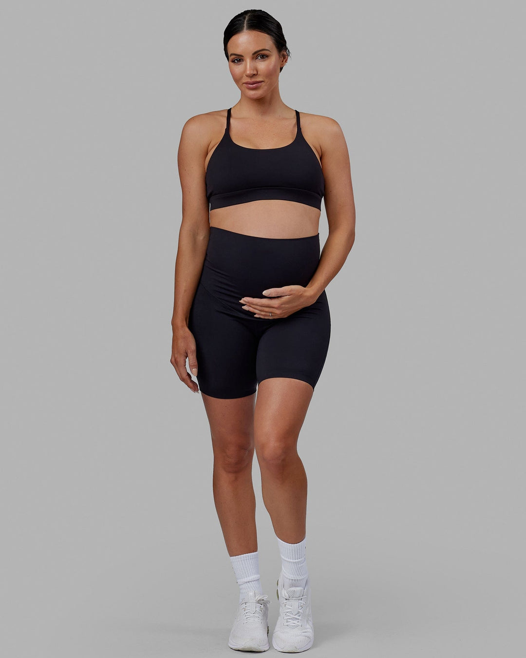 Woman wearing Elixir Ultra High-Rise Maternity 6&quot; Short - Black | Model:Amanda | Size:S