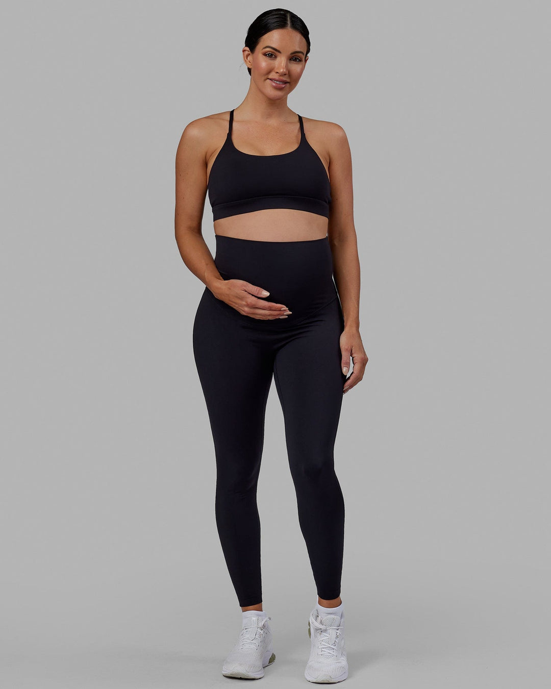 Woman wearing Elixir Ultra High-Rise Maternity Full Length Legging - Black | Model:Amanda | Size:S