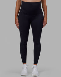 Woman wearing Elixir Ultra High-Rise Maternity Full Length Legging - Black | Model:Amanda | Size:S