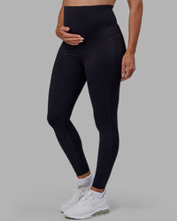 Woman wearing Elixir Ultra High-Rise Maternity Full Length Legging - Black | Model:Amanda | Size:S