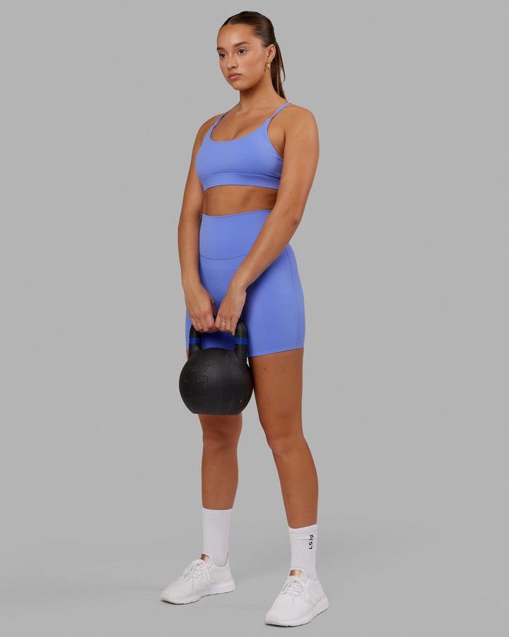 Woman wearing Elixir Mid Short Tight - Indulgent Blue