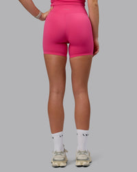 Woman wearing Elixir Ultra High-Rise 6" Short - Pink Flash