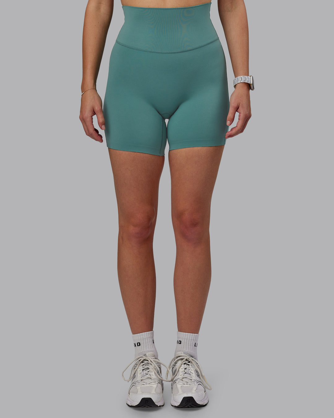 Woman wearing Elixir Ultra High-Rise 6&quot; Short - Sagebrush