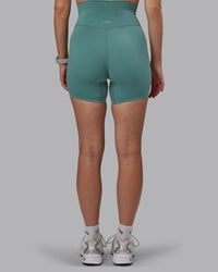 Woman wearing Elixir Ultra High-Rise 6" Short - Sagebrush
