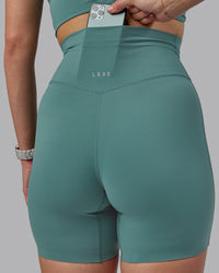 Woman wearing Elixir Ultra High-Rise 6" Short - Sagebrush