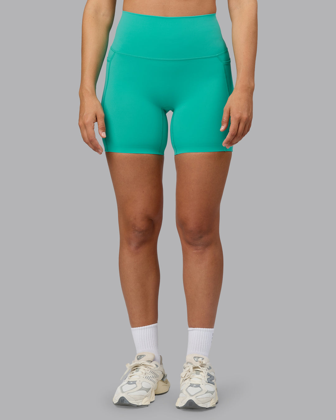 Woman wearing Elixir Ultra High-Rise 6&quot; Short Pockets - Atlantis