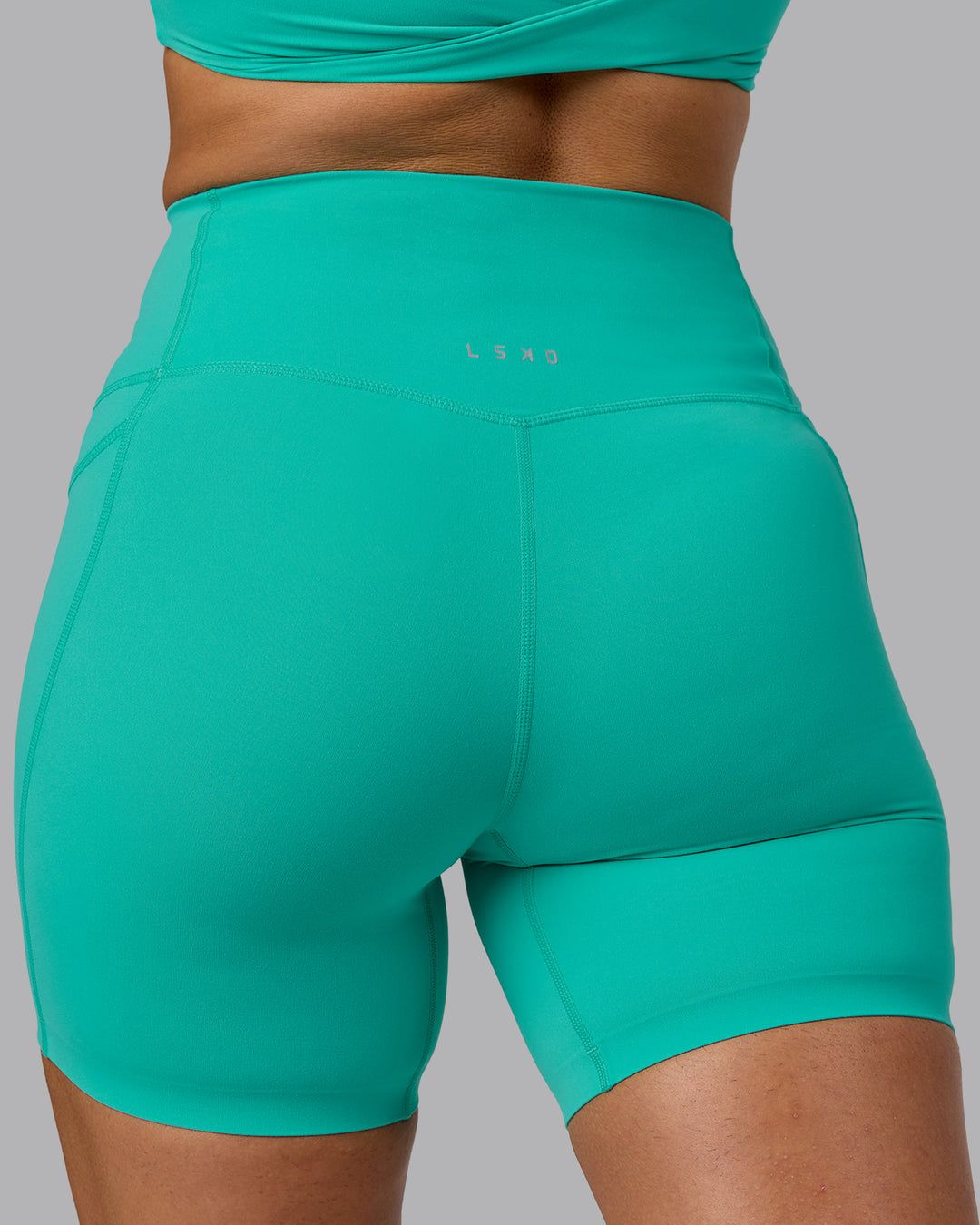 Woman wearing Elixir Ultra High-Rise 6&quot; Short Pockets - Atlantis