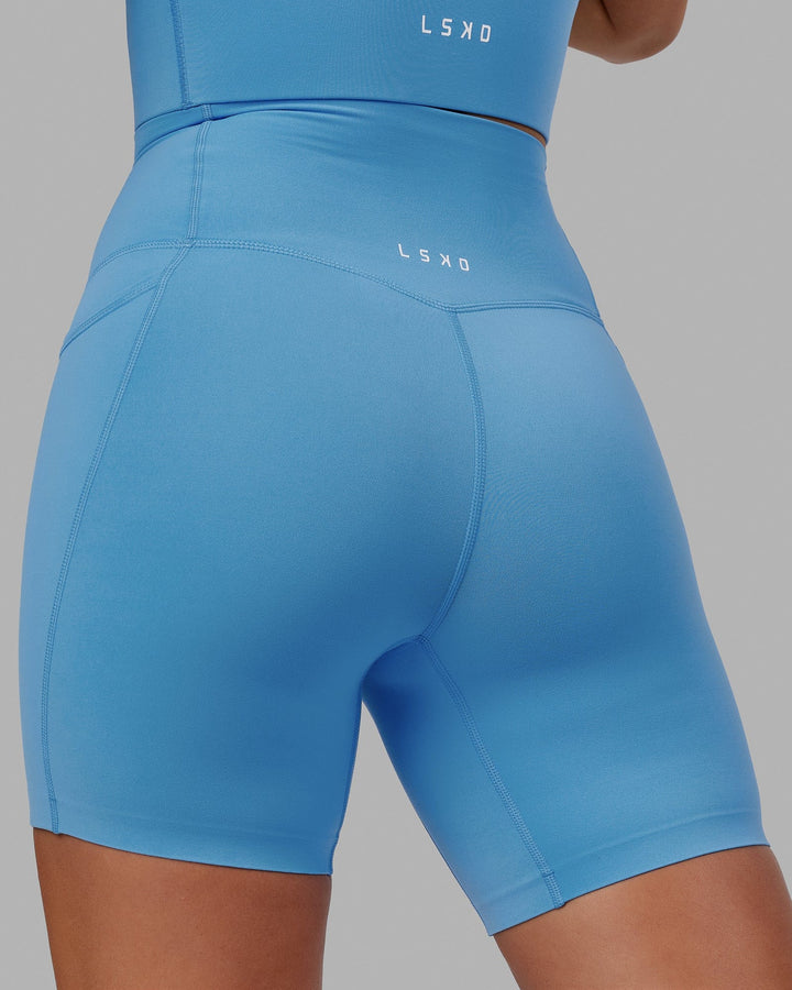 Woman wearing Elixir Mid Short Tight with Pockets - Azure Blue