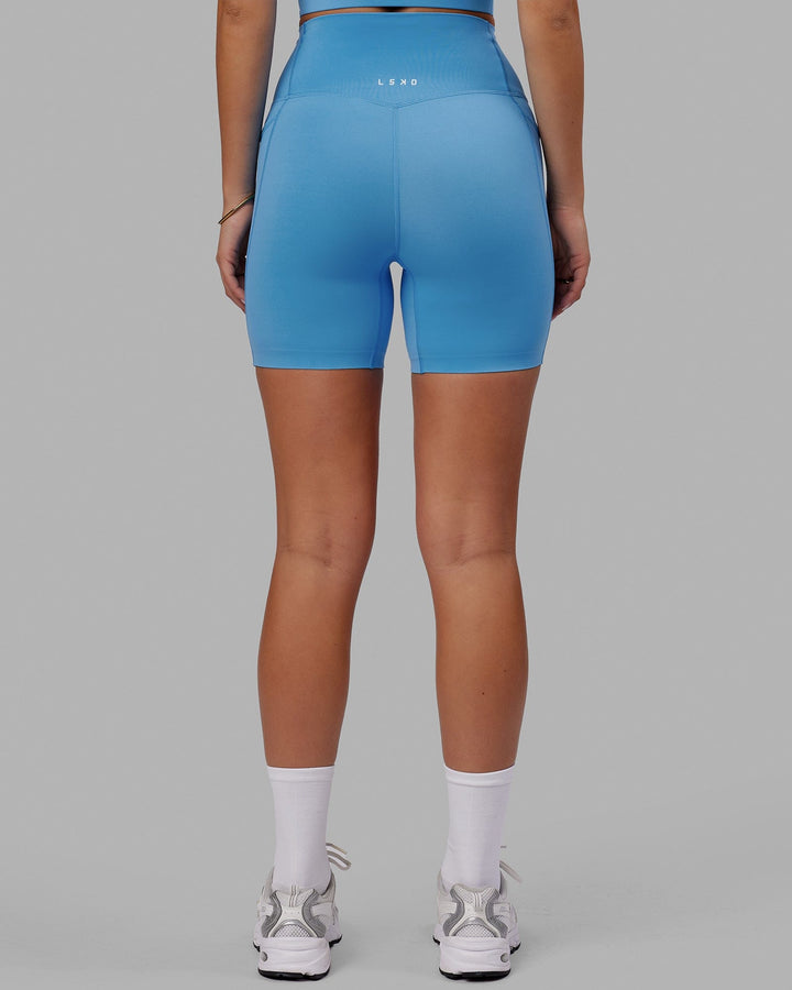Woman wearing Elixir Mid Short Tight with Pockets - Azure Blue