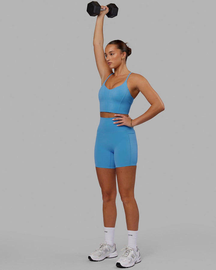 Woman wearing Elixir Mid Short Tight with Pockets - Azure Blue