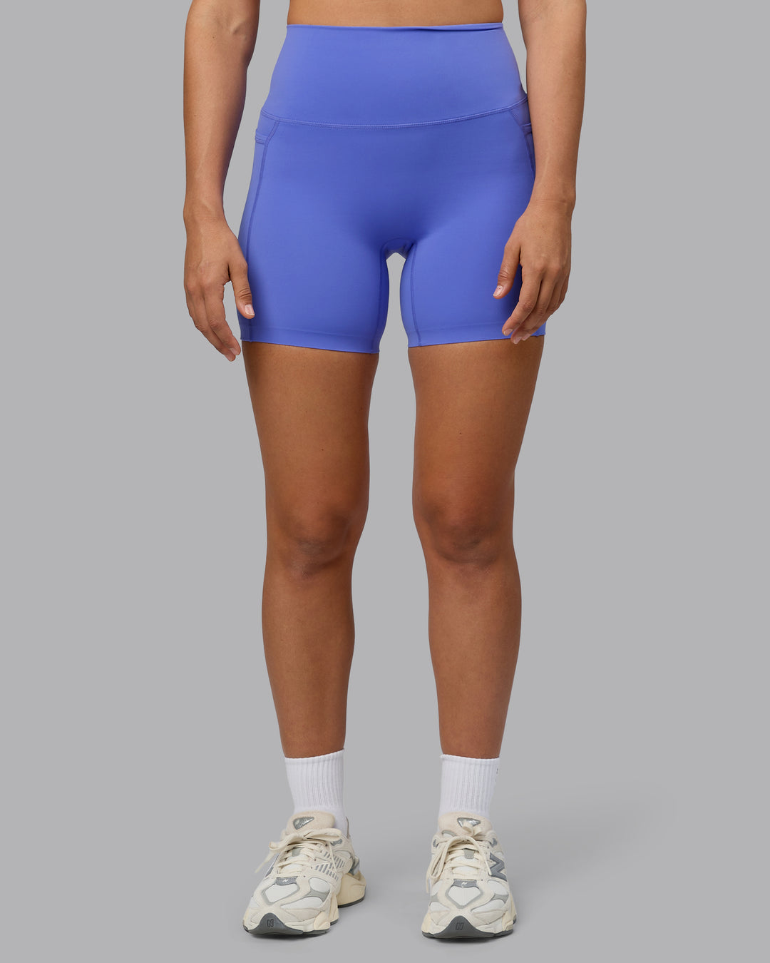 Woman wearing Elixir Ultra High-Rise 6&quot; Short Pockets - Baja Blue