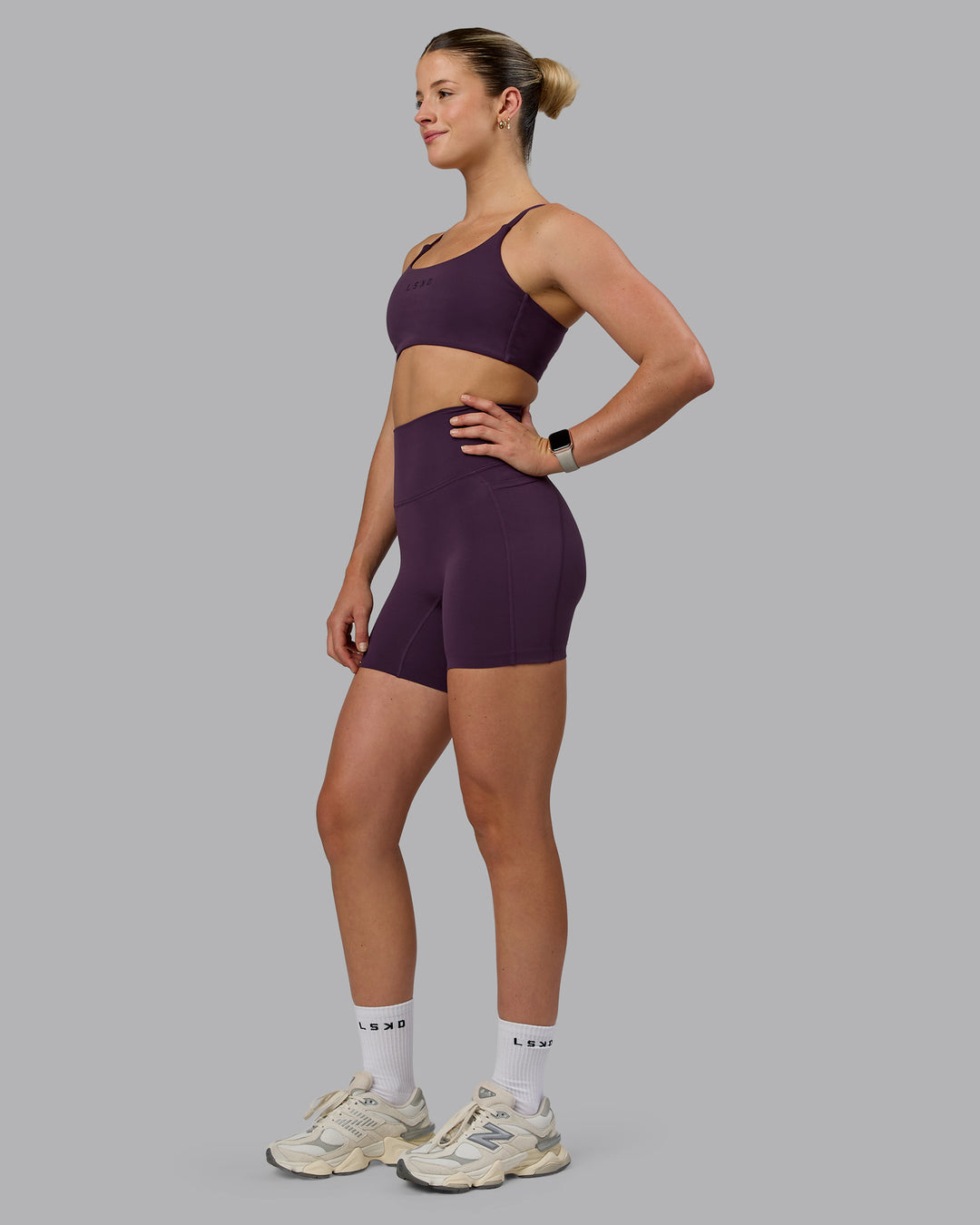 Woman wearing Elixir Ultra High-Rise 6" Short Pockets - Midnight Plum