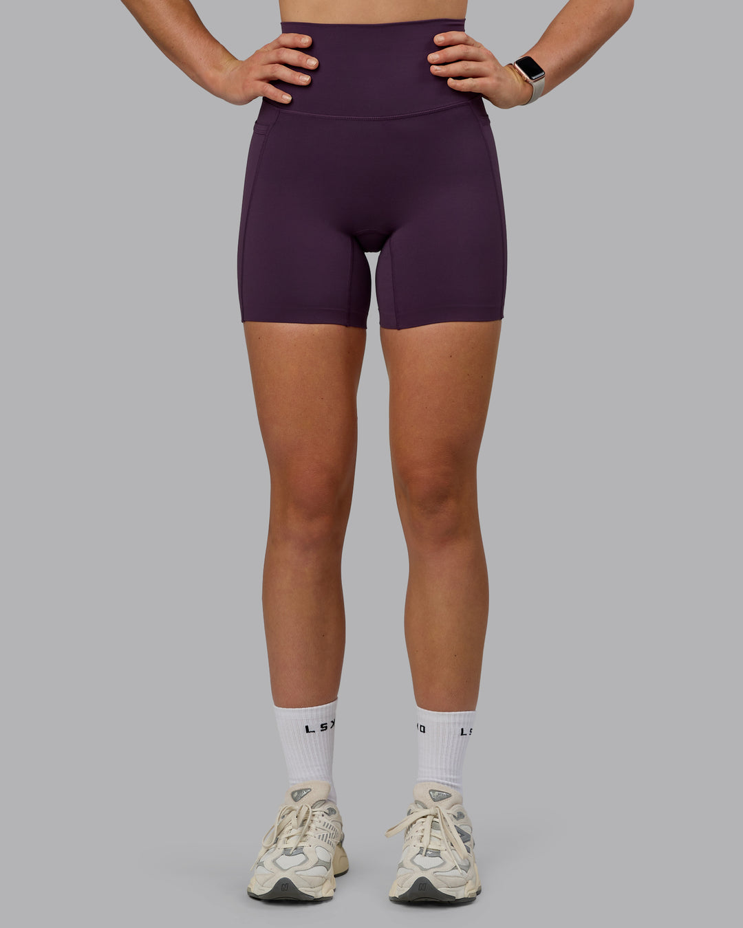 Woman wearing Elixir Ultra High-Rise 6" Short Pockets - Midnight Plum