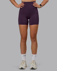 Woman wearing Elixir Ultra High-Rise 6" Short Pockets - Midnight Plum
