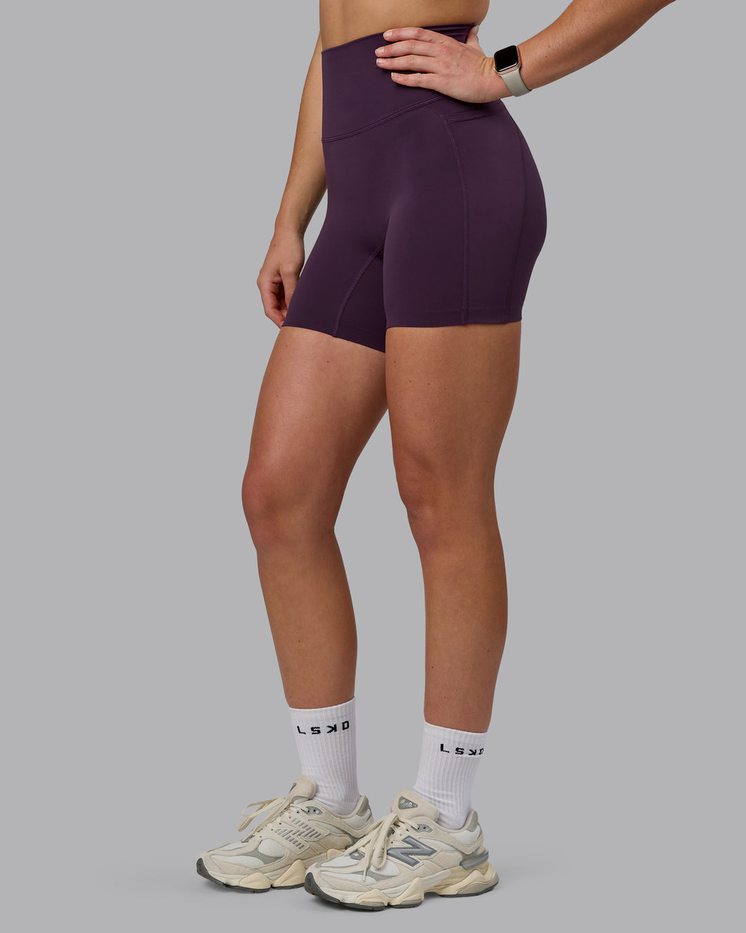 Woman wearing Elixir Ultra High-Rise 6" Short Pockets - Midnight Plum