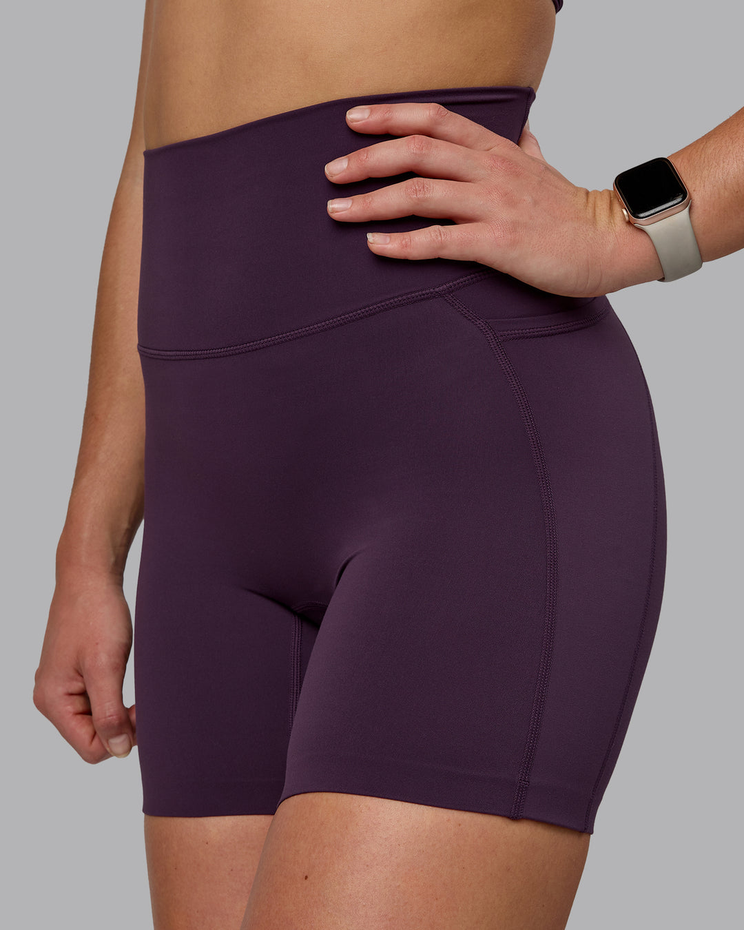 Woman wearing Elixir Ultra High-Rise 6" Short Pockets - Midnight Plum