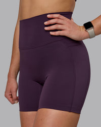 Woman wearing Elixir Ultra High-Rise 6" Short Pockets - Midnight Plum
