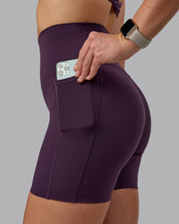 Woman wearing Elixir Ultra High-Rise 6" Short Pockets - Midnight Plum