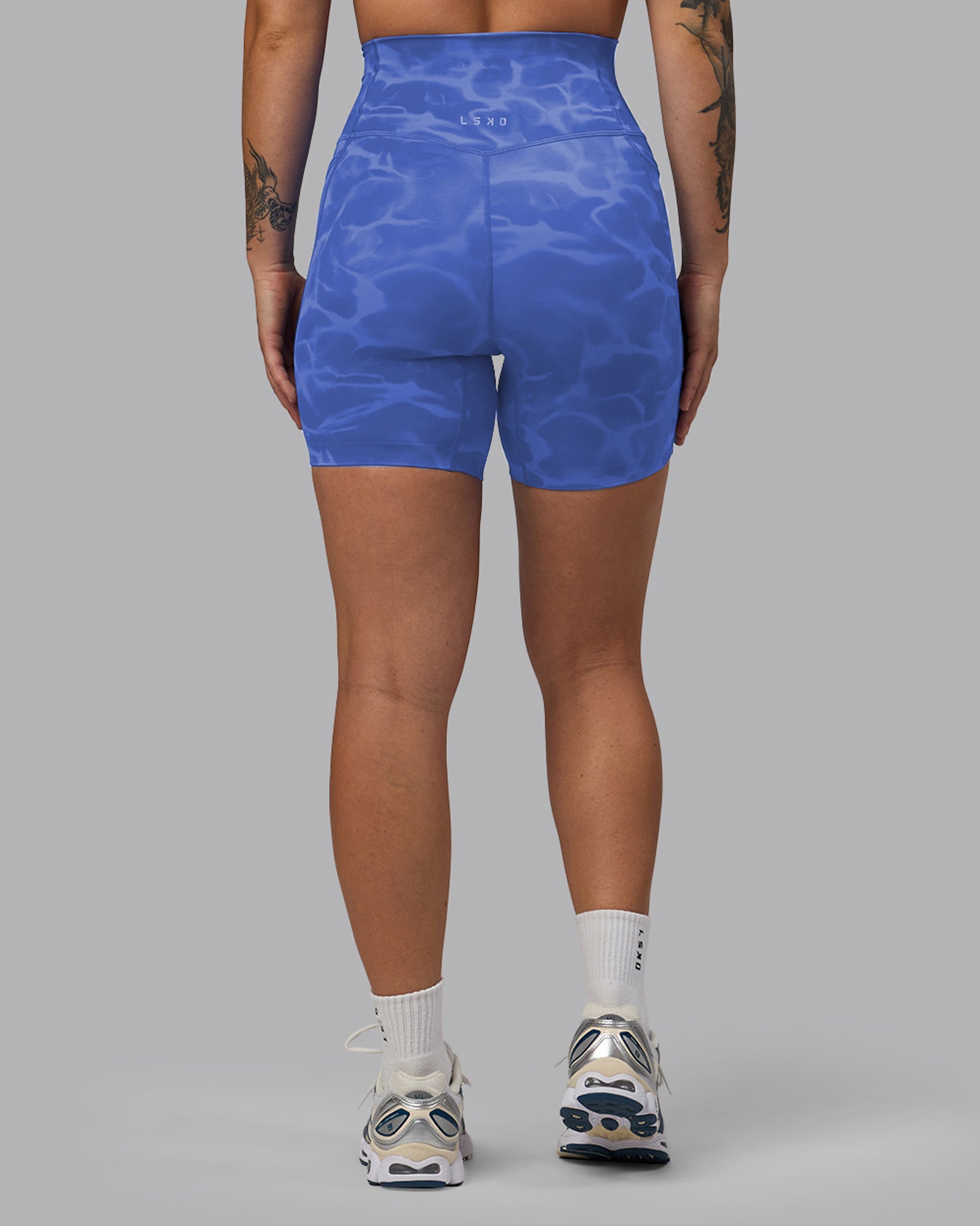 Woman wearing Elixir Ultra High-Rise 6" Short Pockets - Tranquil-Power Cobalt