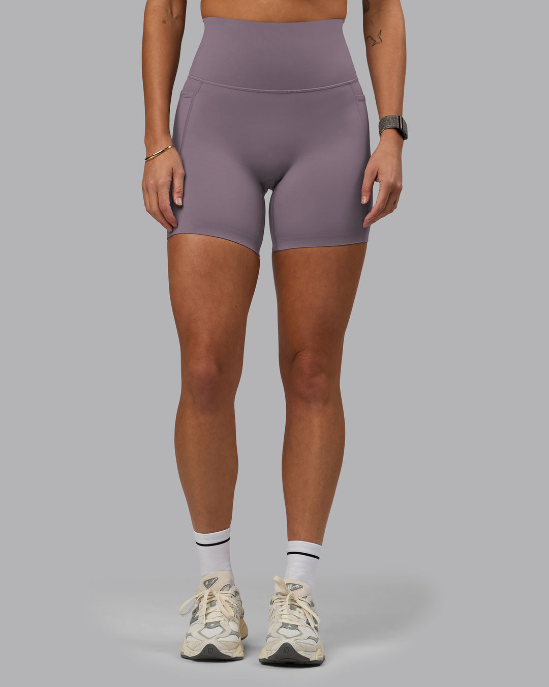 Woman wearing Elixir Ultra High-Rise 6&quot; Short Pockets - Purple Sage