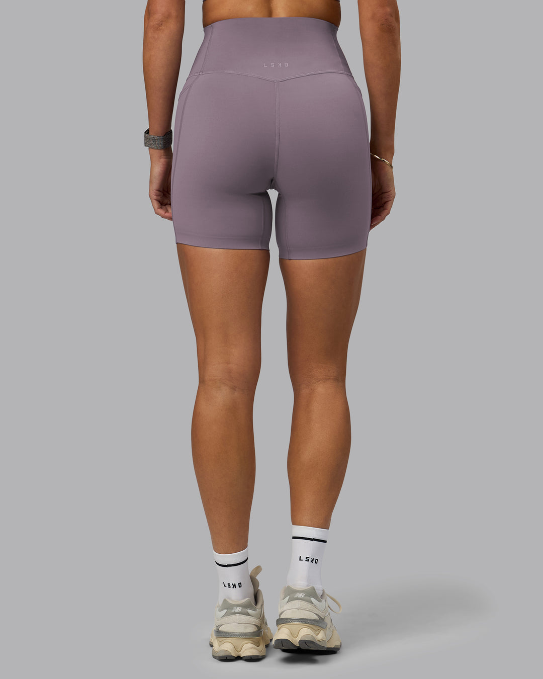 Woman wearing Elixir Ultra High-Rise 6&quot; Short Pockets - Purple Sage