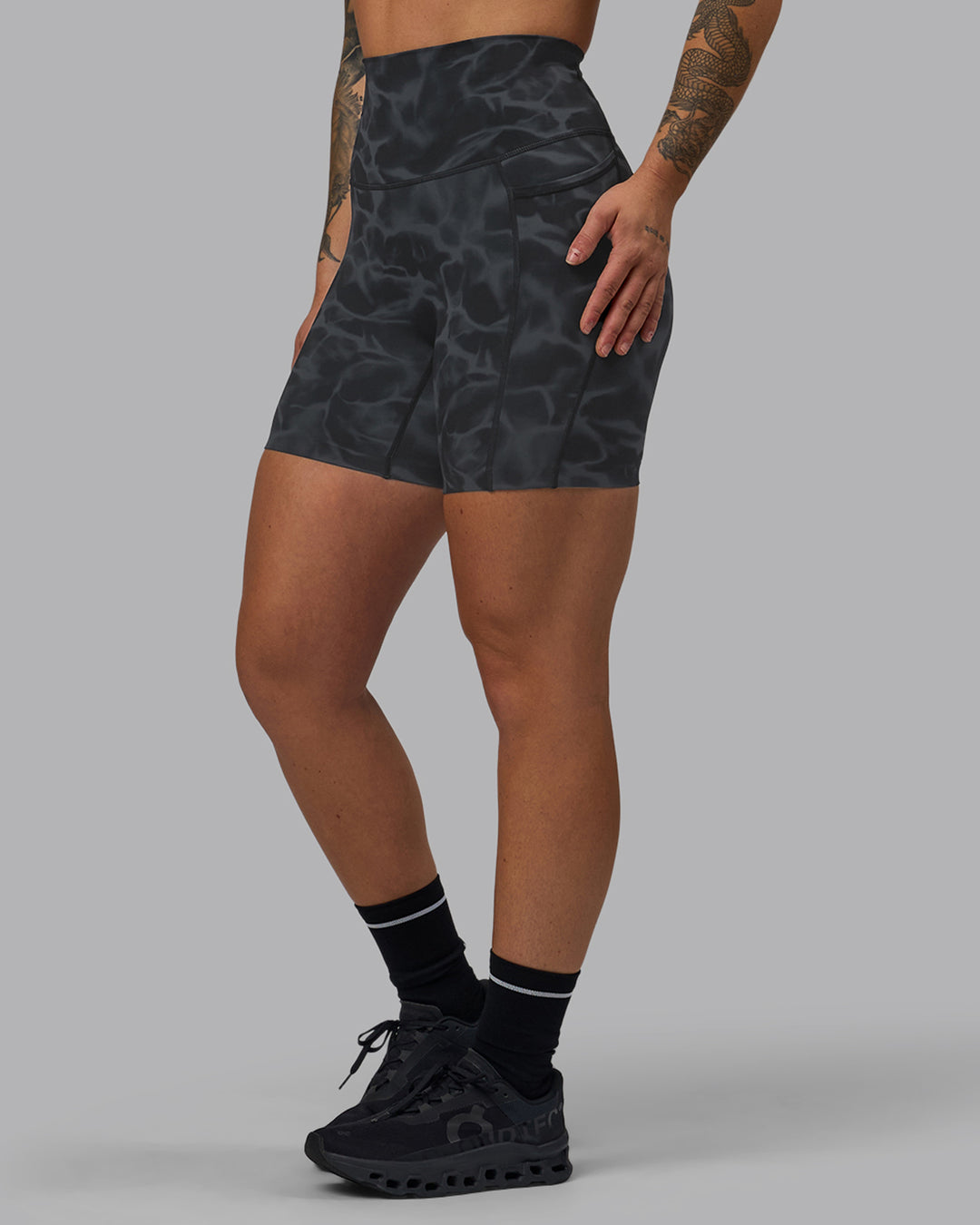 Woman wearing Elixir Ultra High-Rise 6" Short Pockets - Tranquil-Black