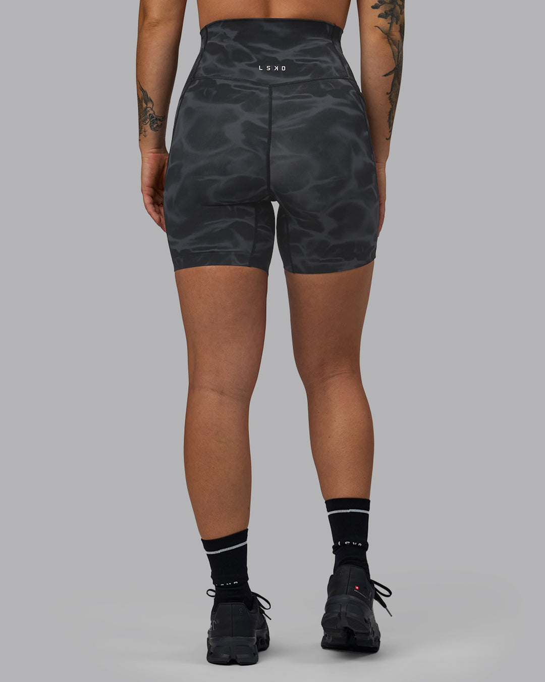 Woman wearing Elixir Ultra High-Rise 6" Short Pockets - Tranquil-Black