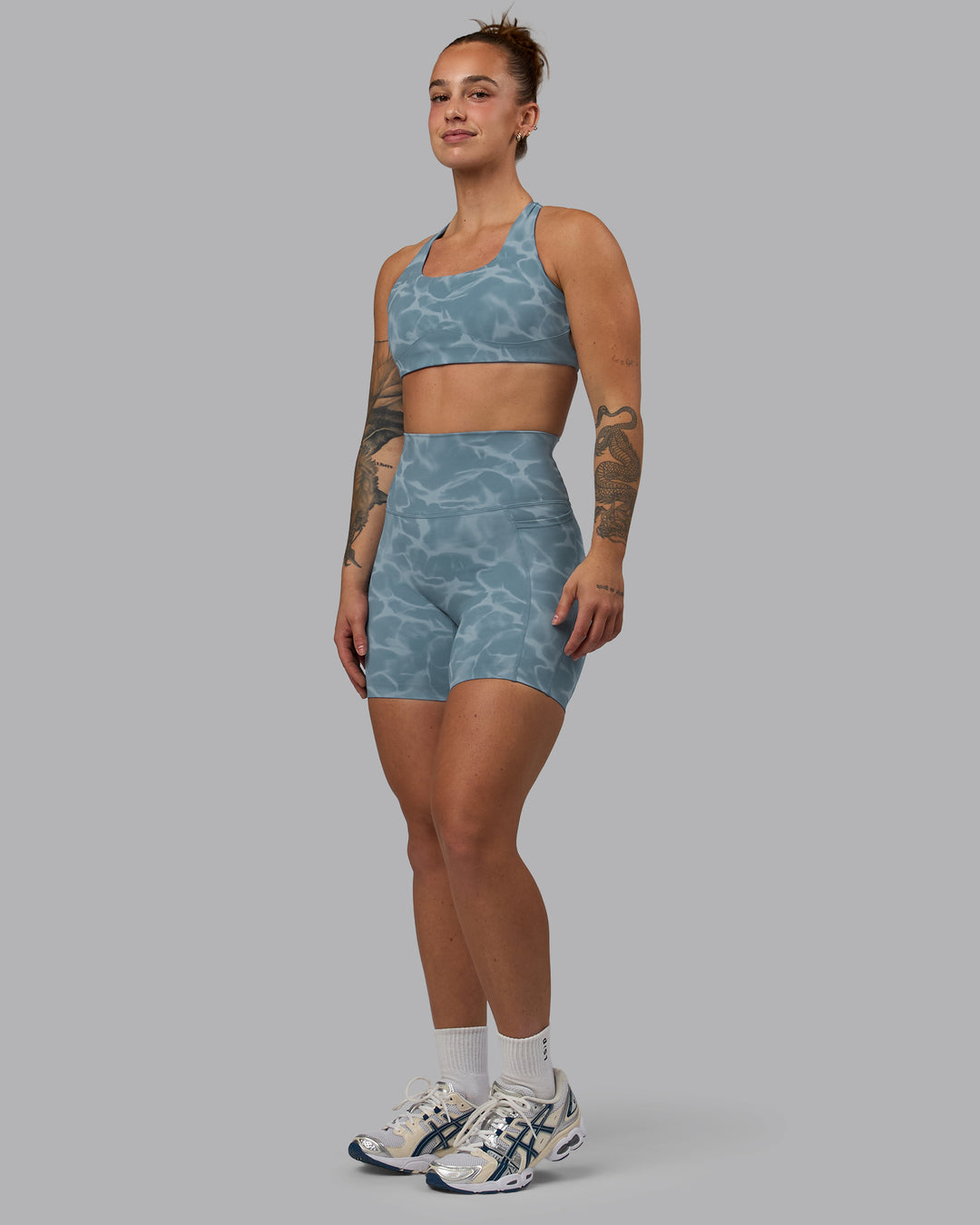 Woman wearing Elixir Ultra High-Rise 6&quot; Short Pockets - Tranquil-Elemental Blue