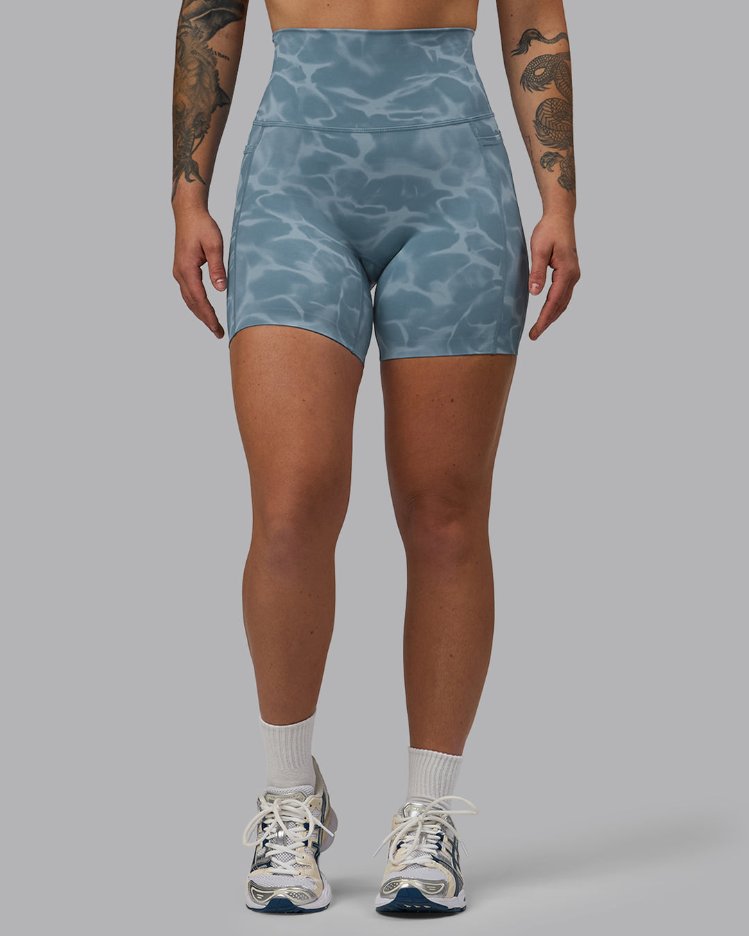 Woman wearing Elixir Ultra High-Rise 6&quot; Short Pockets - Tranquil-Elemental Blue