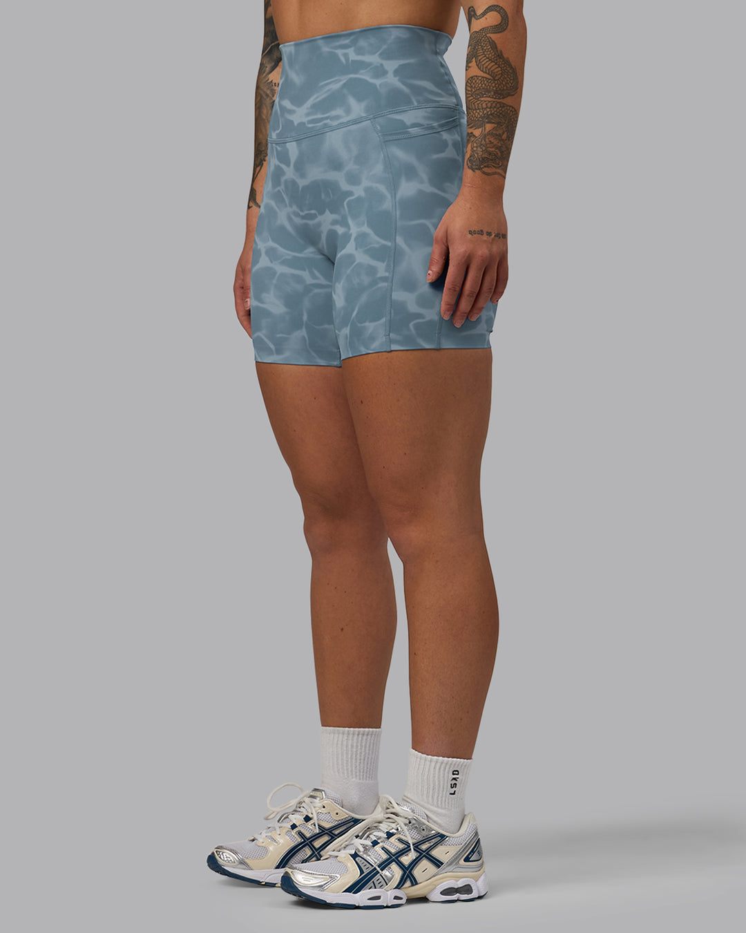 Woman wearing Elixir Ultra High-Rise 6&quot; Short Pockets - Tranquil-Elemental Blue