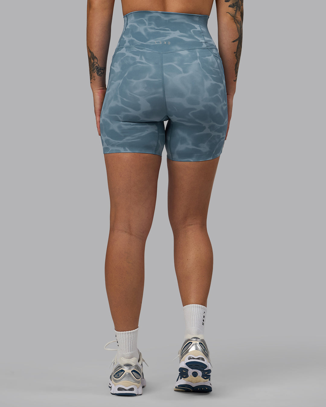 Woman wearing Elixir Ultra High-Rise 6&quot; Short Pockets - Tranquil-Elemental Blue