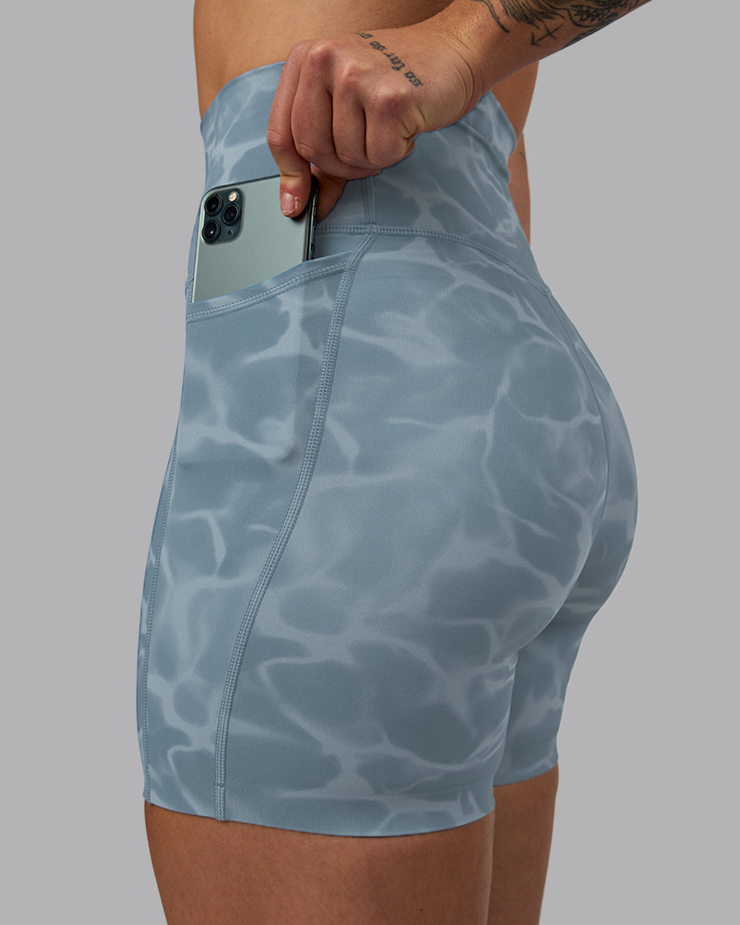 Woman wearing Elixir Ultra High-Rise 6&quot; Short Pockets - Tranquil-Elemental Blue
