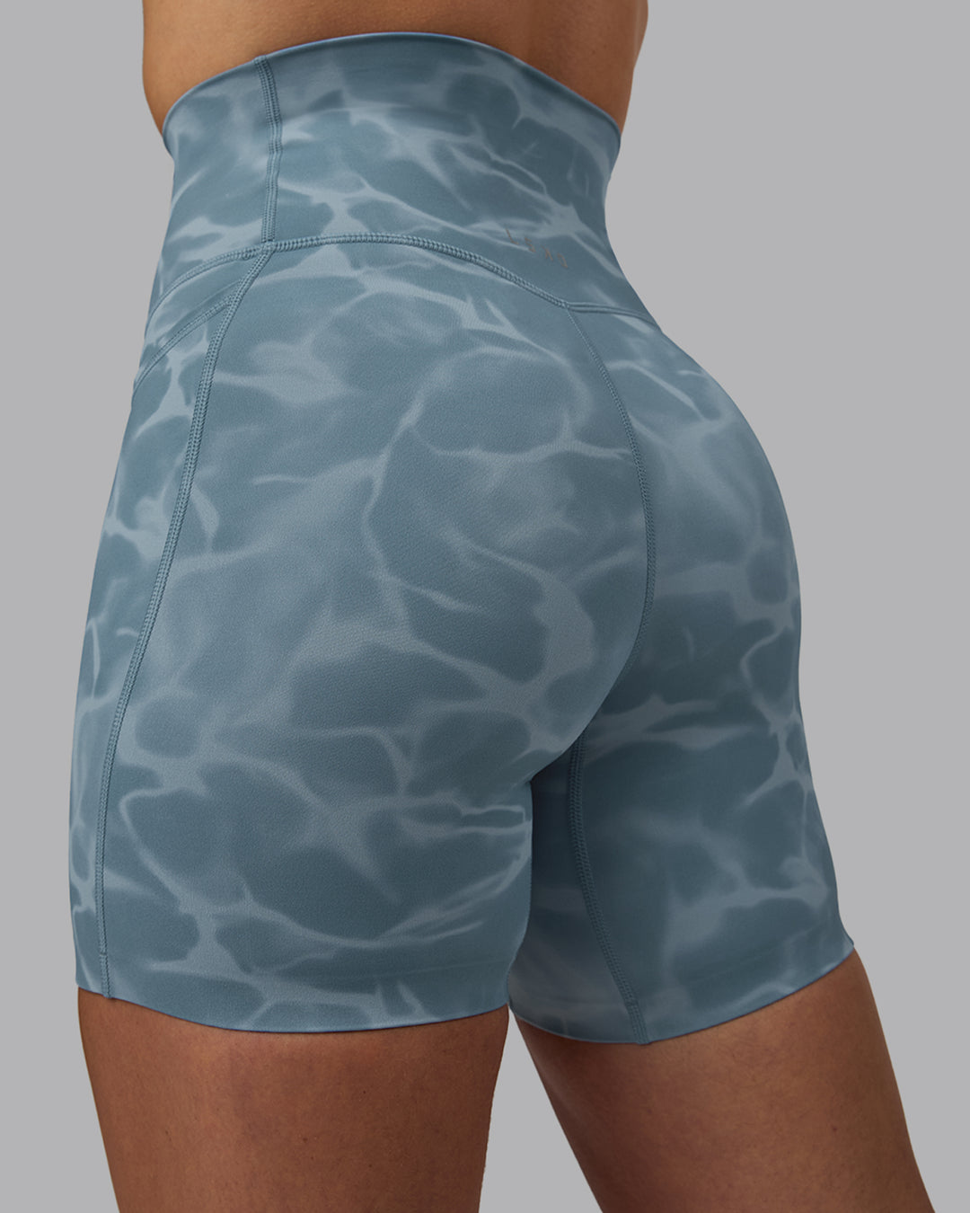 Woman wearing Elixir Ultra High-Rise 6&quot; Short Pockets - Tranquil-Elemental Blue