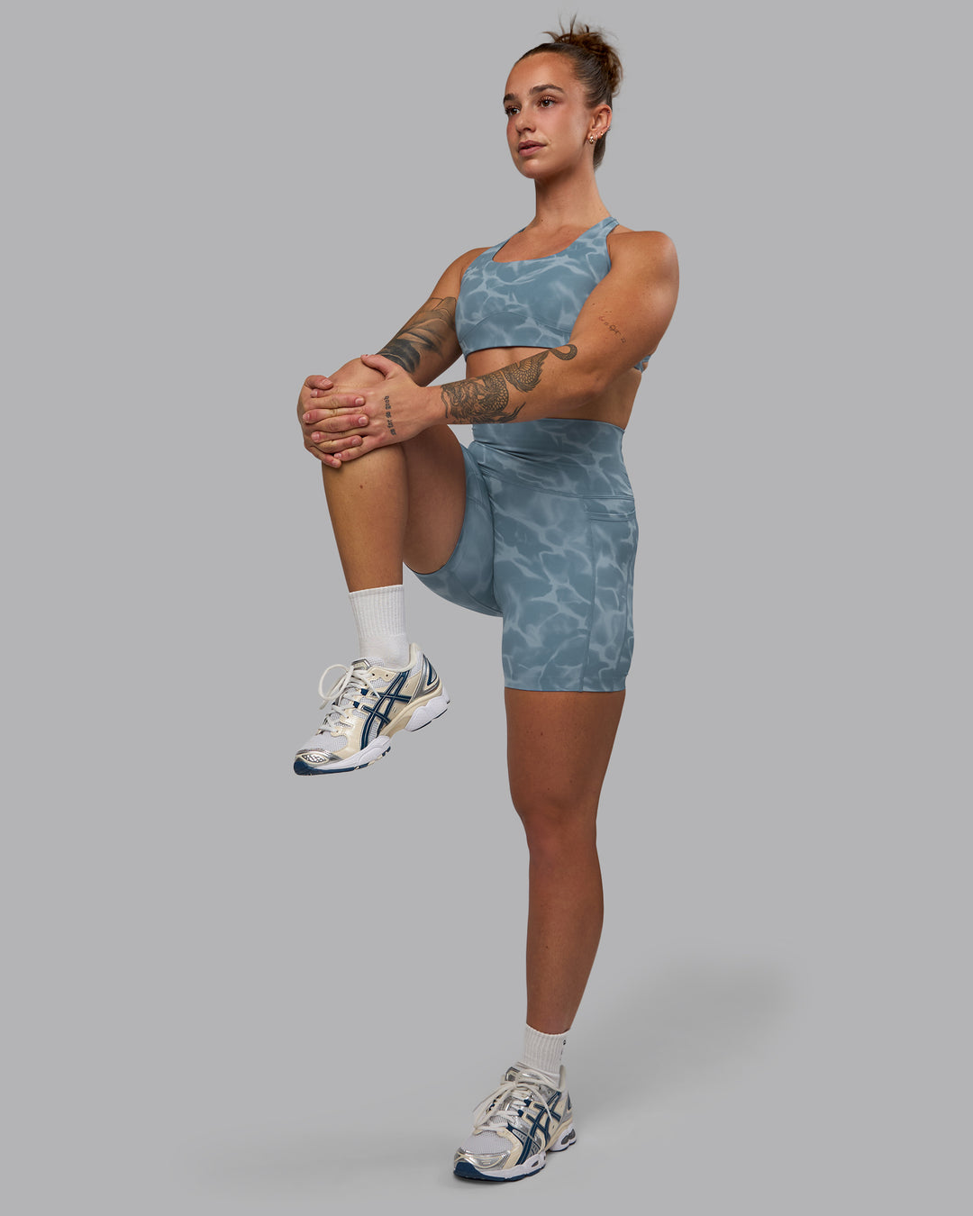 Woman wearing Elixir Ultra High-Rise 6&quot; Short Pockets - Tranquil-Elemental Blue