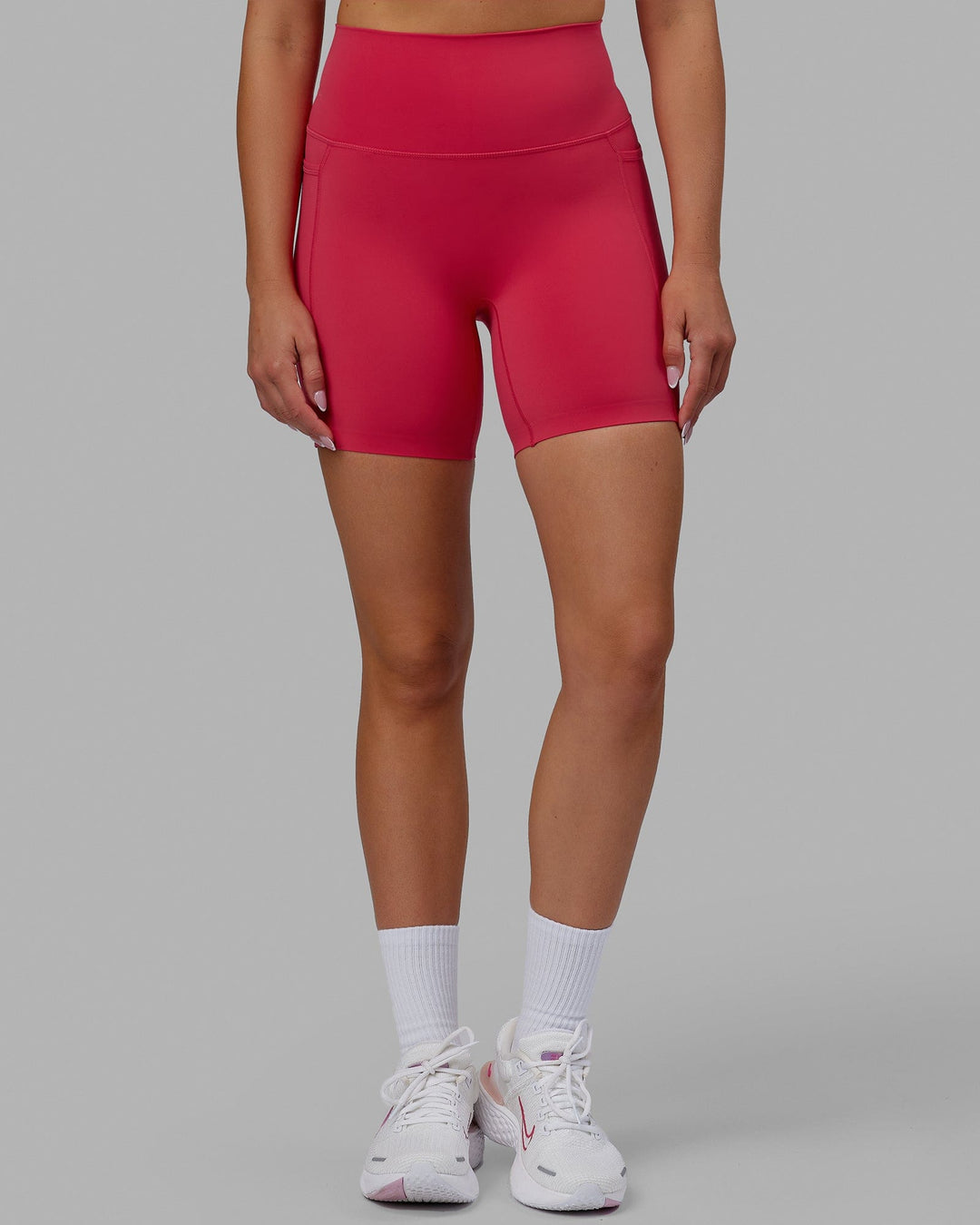 Woman wearing Elixir Mid Short Tights with Pockets - Raspberry