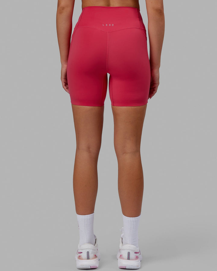 Woman wearing Elixir Mid Short Tights with Pockets - Raspberry