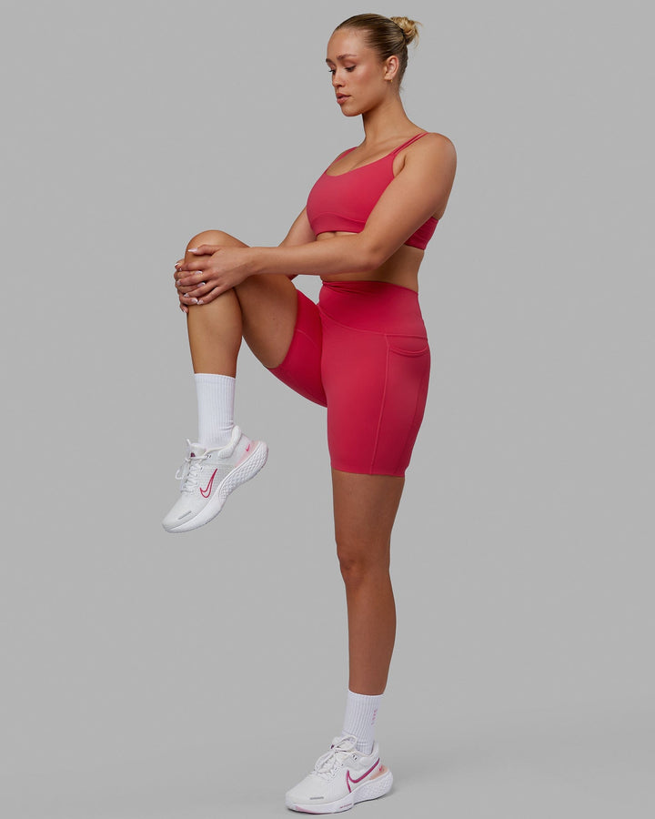 Woman wearing Elixir Mid Short Tights with Pockets - Raspberry