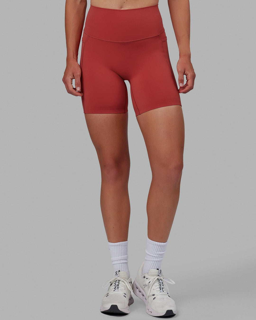 Woman wearing Elixir Mid Short Tights with Pockets - Cardinal