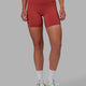 Woman wearing Elixir Mid Short Tights with Pockets - Cardinal