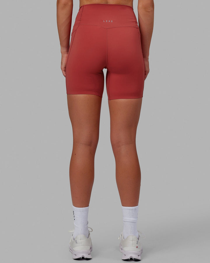 Woman wearing Elixir Mid Short Tights with Pockets - Cardinal