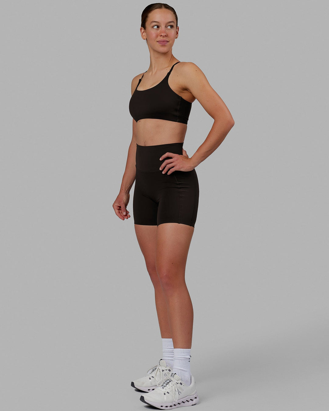 Woman wearing Elixir Mid Short Tights with Pockets - Dark Walnut