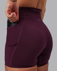 Woman wearing Elixir Ultra High-Rise 6" Short Pockets - Cherry Lacquer